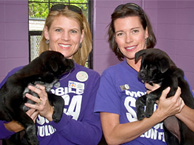 Shelter Volunteer with Puppy